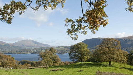 Lake and mountain view on a sunny autumn day, Derwent Water in the Lake District.